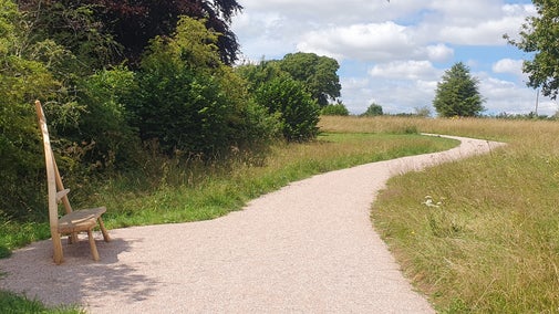 Perimeter Path, bench and meadow at A la Ronde, Devon.